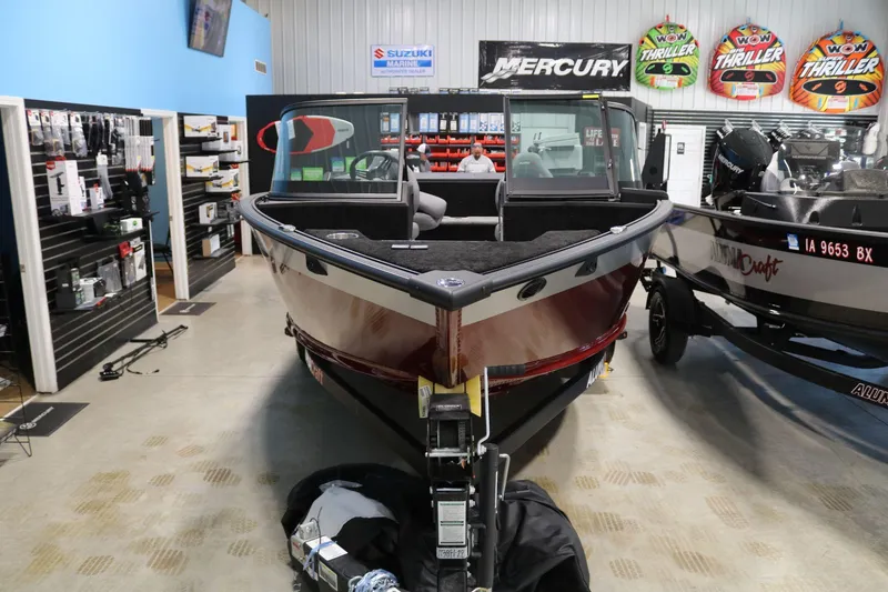 Slide: The Image of 2025 Alumacraft Competitor 175X Sport Rotax S boat displayed in showroom. - 5