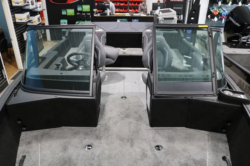 Slide: The Image of 2025 Alumacraft Competitor 175X Sport Rotax S interior with dual consoles and seating. - 6