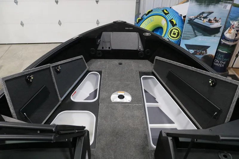Slide: The Image of 2025 Alumacraft Competitor 175X Sport Rotax S boat interior with open storage compartments. - 8