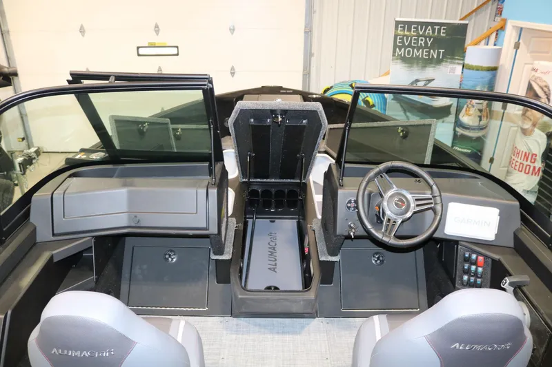 Slide: The Image of 2025 Alumacraft Competitor 175X Sport Rotax S boat interior with steering wheel and dashboard. - 9