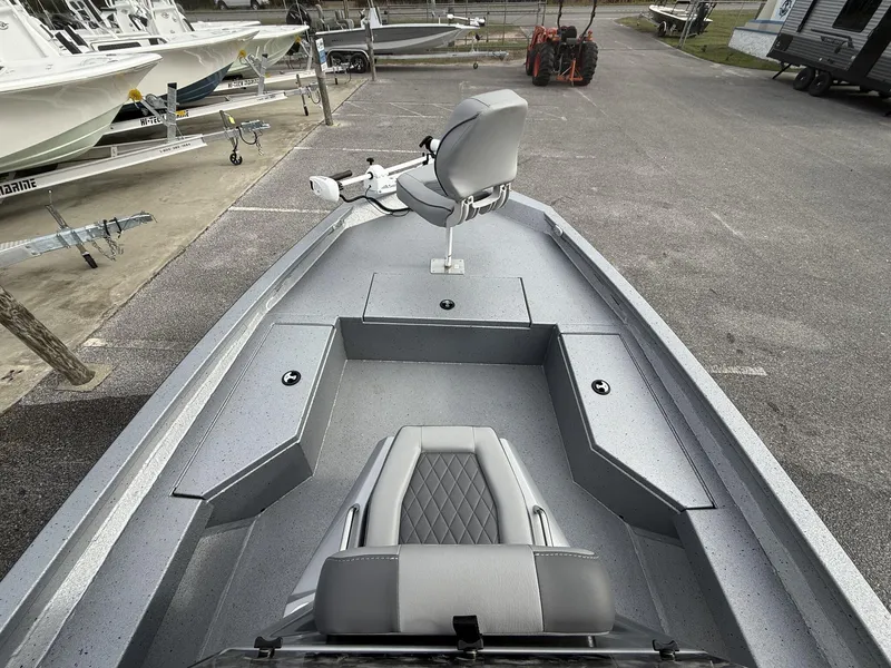Slide: The Image of 2025 Xpress Hyper-Lift Series H20B boat with new console, parked in a marina. - 3