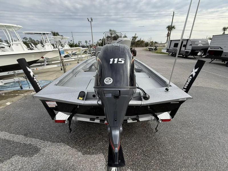 Slide: The Image of 2025 Xpress Hyper-Lift Series H20B boat with 115 engine, displayed in a marina. - 4