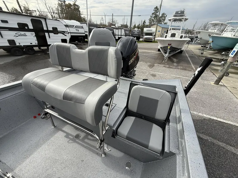Slide: The Image of 2025 Xpress Hyper-Lift Series H20B boat interior with gray seating and console. - 9