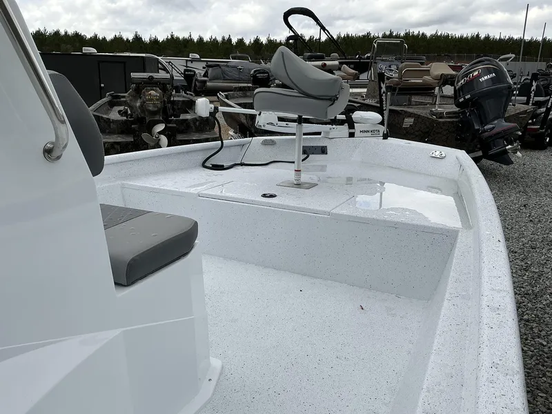 Slide: The Image of 2025 Xpress Xplorer Series XP20CC boat with seating and motor, displayed outdoors. - 3