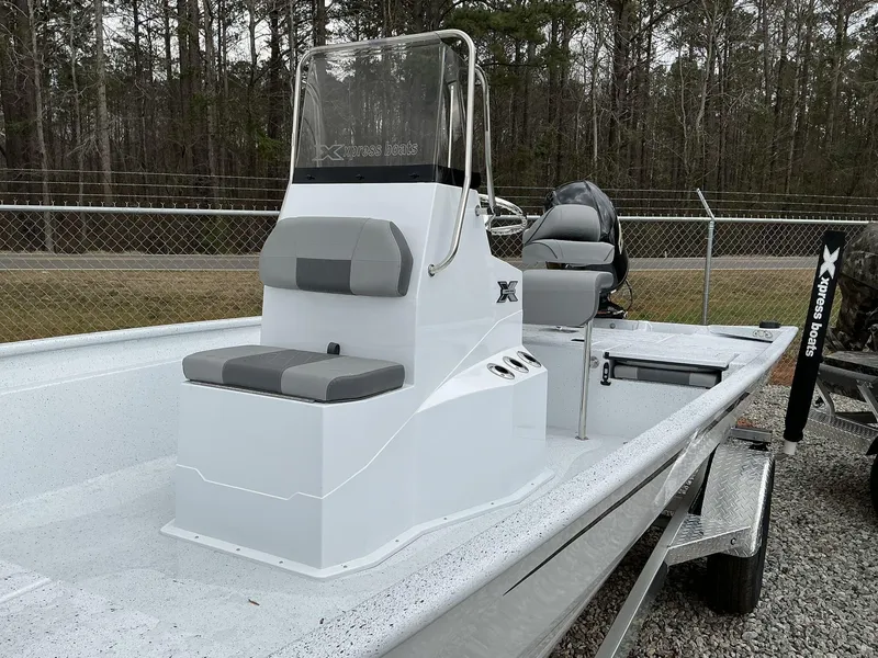Slide: The Image of 2025 Xpress Xplorer Series XP20CC boat on trailer, featuring sleek design and modern seating. - 6