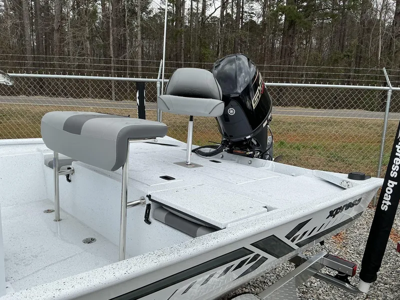 Slide: The Image of 2025 Xpress Xplorer Series XP20CC boat with Yamaha engine, parked outdoors. - 7