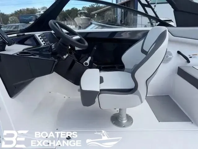 Slide: The Image of Interior of 2025 Yamaha AR220 boat with steering console and seat. - 5