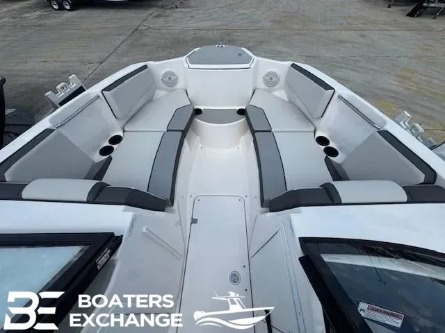 Slide: The Image of Interior view of 2025 Yamaha AR220 boat with gray seating. - 7