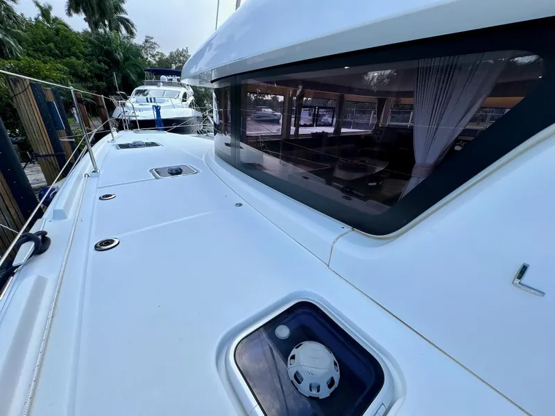 Slide: The Image of 2019 Lagoon 42 yacht deck with sleek design and spacious interior view. - 13
