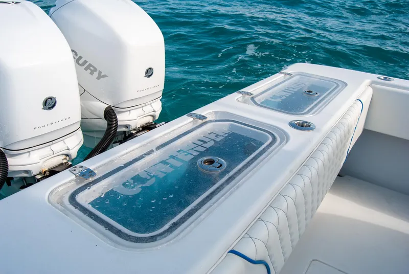 Slide: The Image of 2019 Contender 39 ST boat with dual Mercury engines on blue water. - 13