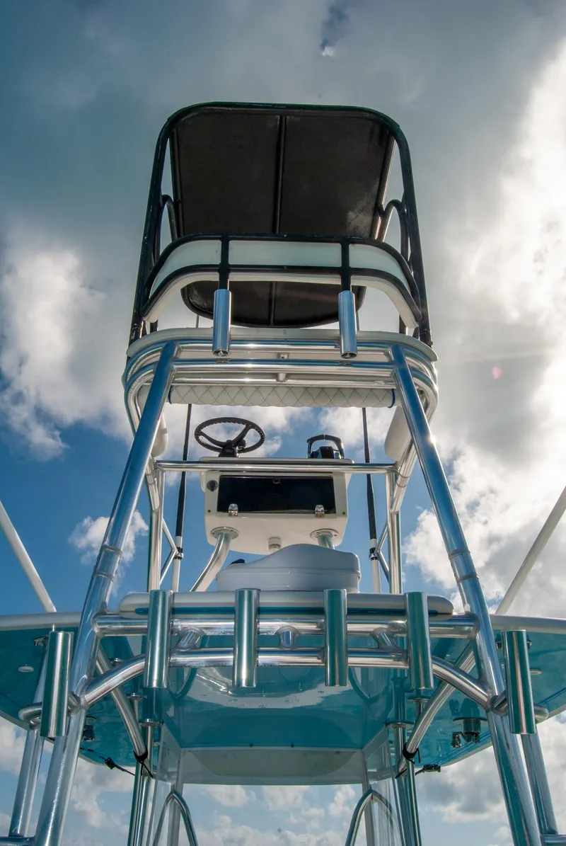 Slide: The Image of 2019 Contender 39 ST boat tower against a cloudy sky. - 21