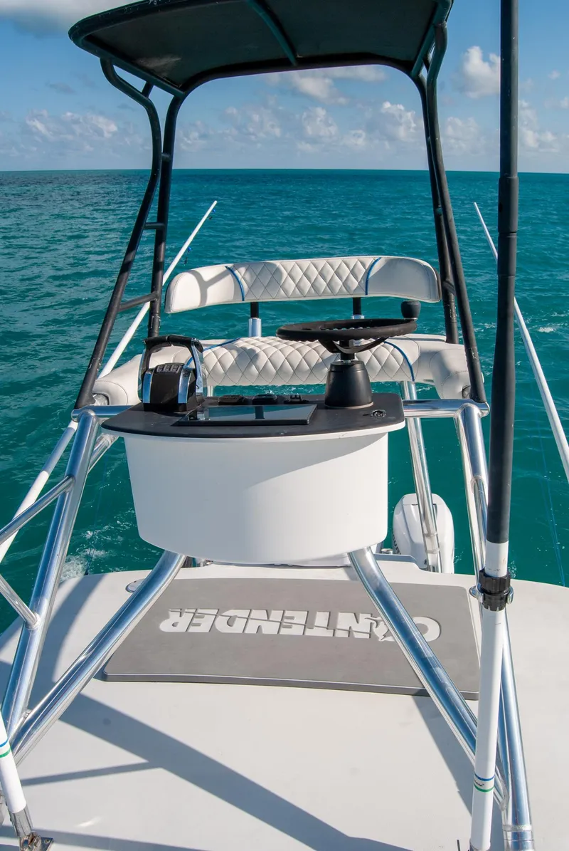 Slide: The Image of 2019 Contender 39 ST boat helm with ocean view and clear skies. - 25
