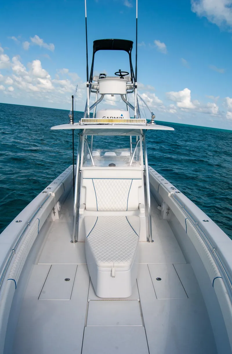 Slide: The Image of 2019 Contender 39 ST boat on open sea under blue sky. - 30