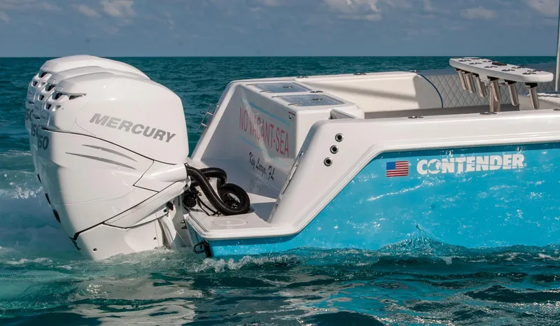 Slide: The Image of 2019 Contender 39 ST boat with Mercury engines on clear blue water. - 35