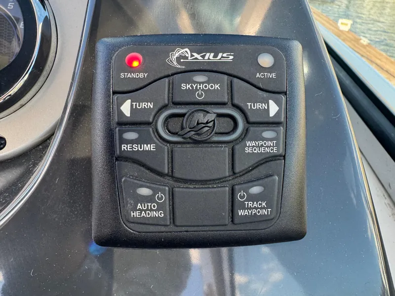 Slide: The Image of Axius control panel on 2016 Sea Ray 370 Sundancer boat dashboard. - 19