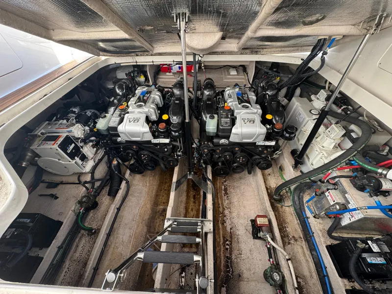 Slide: The Image of Engine room of 2016 Sea Ray 370 Sundancer with twin engines and mechanical components. - 34