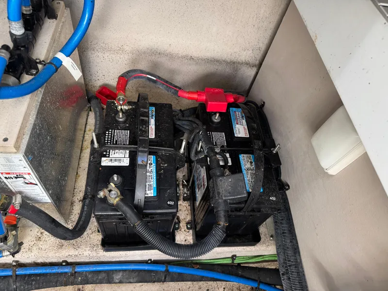 Slide: The Image of Batteries in a 2016 Sea Ray 370 Sundancer engine compartment. - 39