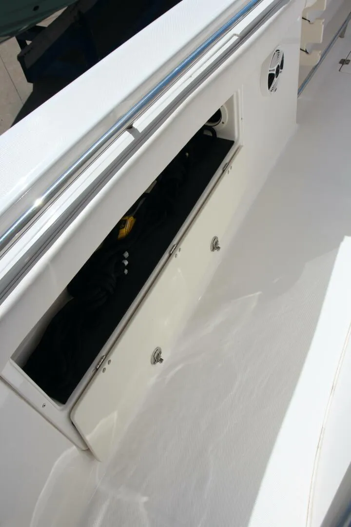 Slide: The Image of 2013 Robalo R300 Center Console storage compartment detail. - 15