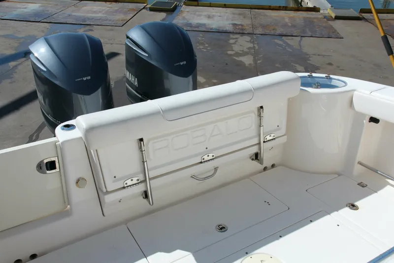 Slide: The Image of 2013 Robalo R300 Center Console boat with dual Yamaha outboard engines. - 16