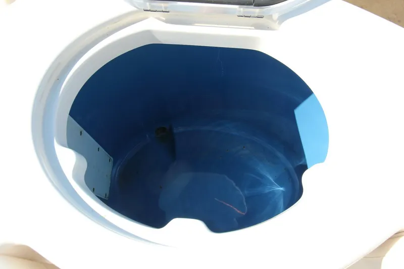 Slide: The Image of Livewell of 2013 Robalo R300 Center Console boat, open and empty. - 20