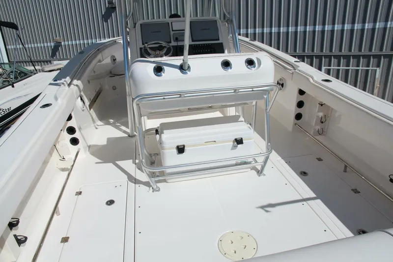 Slide: The Image of 2013 Robalo R300 Center Console boat interior with steering console and seating. - 7