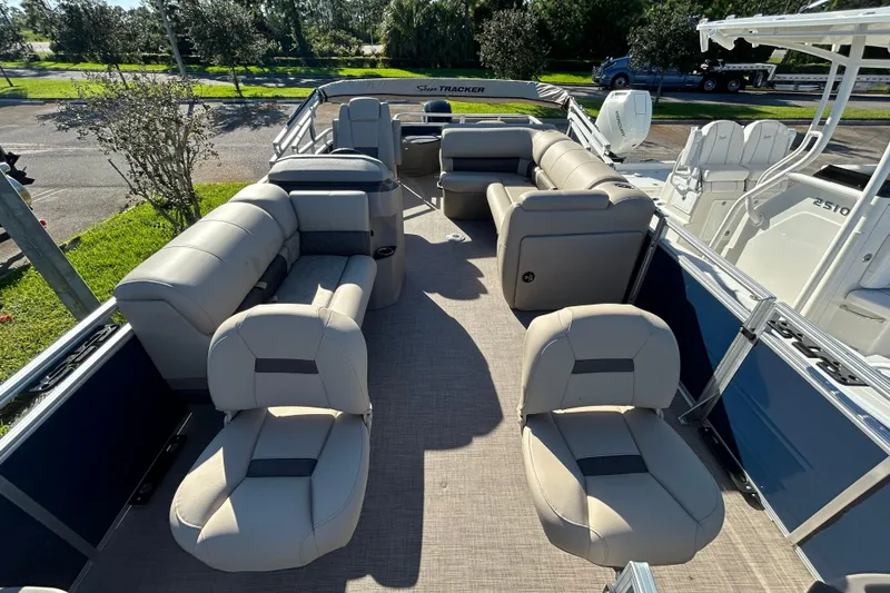Slide: The Image of 2025 Sun Tracker Fishin' Barge 20 DLX with spacious seating and modern design. - 2