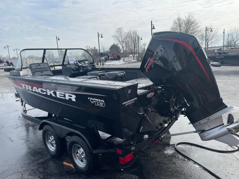 Slide: The Image of 2025 Tracker Targa V-19 WT boat on trailer, parked outdoors. - 4