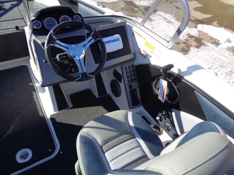 Slide: The Image of 2024 Ranger 1850MS boat cockpit with steering wheel and control panel. - 10