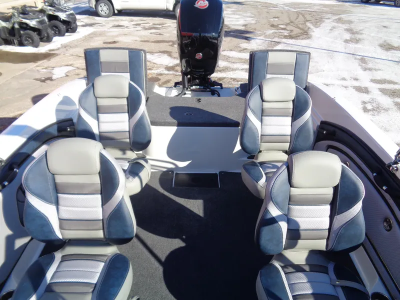 Slide: The Image of 2024 Ranger 1850MS boat interior with four cushioned seats and motor. - 6