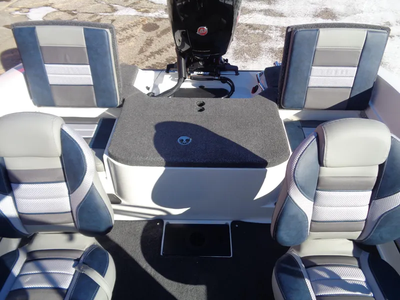 Slide: The Image of 2024 Ranger 1850MS boat interior with four cushioned seats and motor. - 7