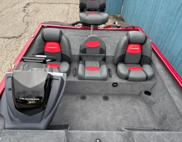 Slide: The Image of 2025 Tracker Savage 215 boat interior with gray and red seating. - 18