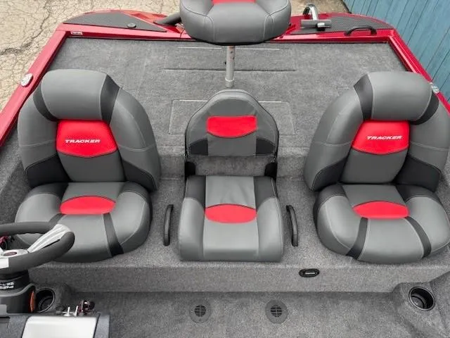 Slide: The Image of 2025 Tracker Savage 215 boat interior with gray and red seating. - 19