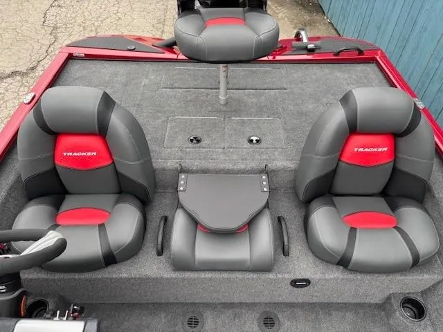 Slide: The Image of 2025 Tracker Savage 215 boat interior with gray and red seating. - 20