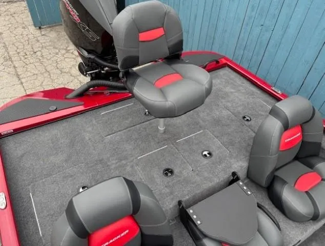 Slide: The Image of 2025 Tracker Savage 215 boat interior with gray and red seating. - 21