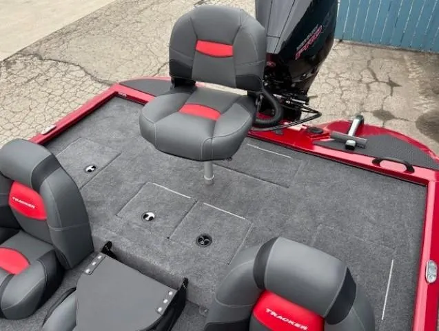Slide: The Image of 2025 Tracker Savage 215 boat interior with gray and red seating. - 22