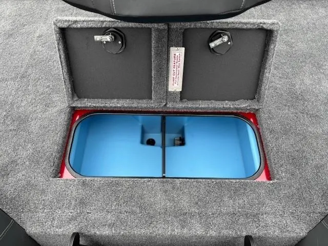 Slide: The Image of 2025 Tracker Savage 215 boat storage compartment with dual lids and blue interior. - 24