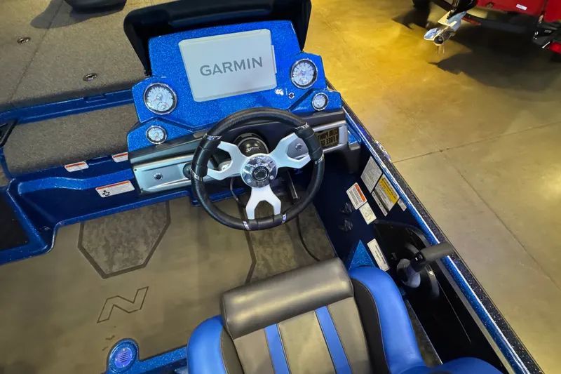 Slide: The Image of 2025 Nitro Z20 XL Pro boat cockpit with Garmin display and steering wheel. - 8