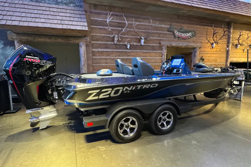 Slide: The Image of 2025 Nitro Z20 XL Pro boat with Mercury Pro XS engine in showroom setting. - 3