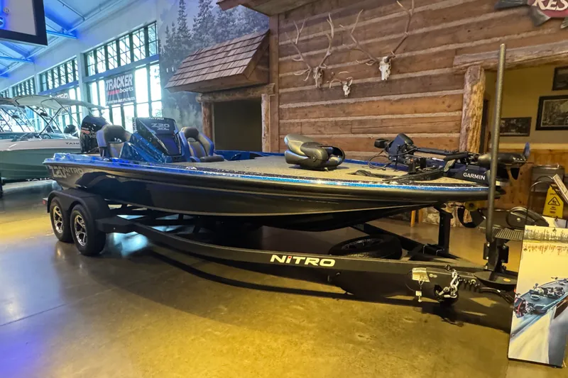 Slide: The Image of 2025 Nitro Z20 XL Pro boat displayed indoors on a trailer. - 2