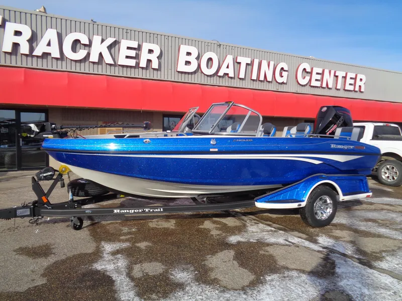 Slide: The Image of 2024 Ranger 1880MS boat in blue at Tracker Boating Center. - 3