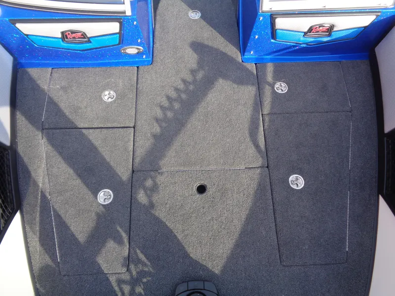 Slide: The Image of 2024 Ranger 1880MS boat interior with carpeted flooring and storage compartments. - 9