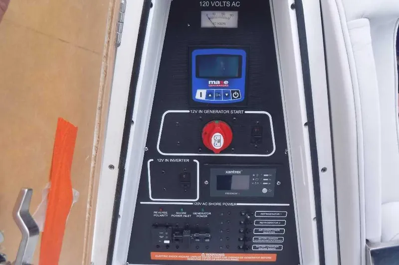 Slide: The Image of Control panel of a 2020 Sea Fox 368 Commander boat, featuring generator and inverter controls. - 11