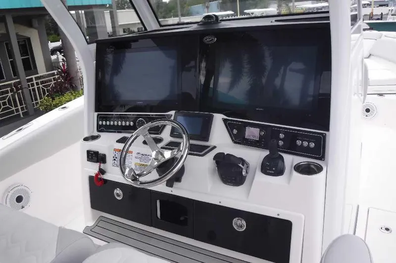 Slide: The Image of 2020 Sea Fox 368 Commander helm with dual screens and modern controls. - 14