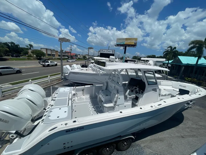 Slide: The Image of 2020 Sea Fox 368 Commander boat displayed outdoors under a clear blue sky. - 28
