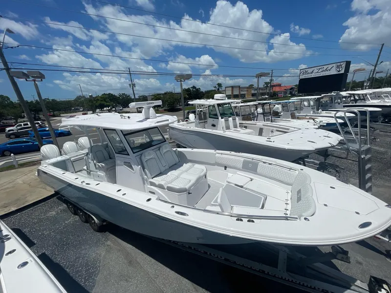 Slide: The Image of 2020 Sea Fox 368 Commander boat displayed outdoors under a clear blue sky. - 29