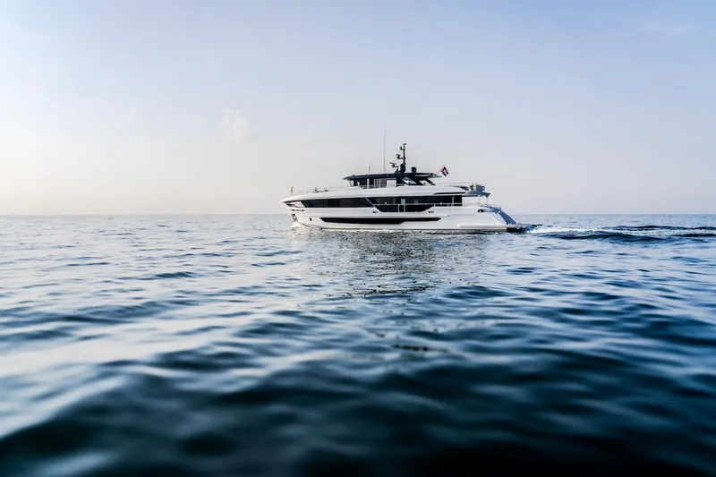 Slide: The Image of Majesty 100 Terrace yacht cruising on open sea, 2025 model. - 13