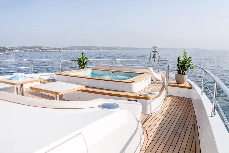 Slide: The Image of Luxurious 2025 Majesty 100 Terrace yacht deck with jacuzzi and ocean view. - 18