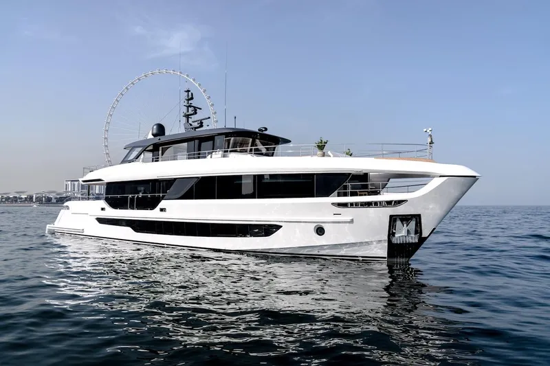 Slide: The Image of Luxury Majesty 100 Terrace yacht, 2025 model, cruising on calm waters under a clear sky. - 2