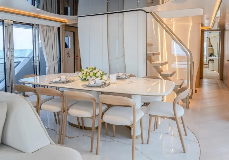 Slide: The Image of Luxurious dining area on 2025 Majesty 100 Terrace yacht with elegant decor and modern design. - 27