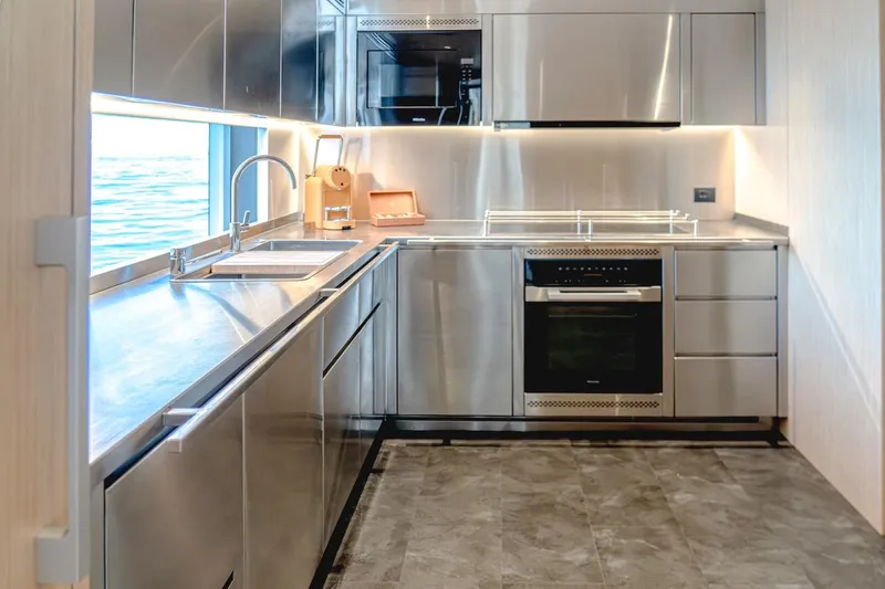 Slide: The Image of Modern stainless steel kitchen in 2025 Majesty 100 Terrace yacht. - 28